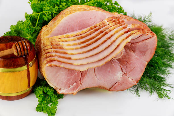 istock Presliced smoked pork ham with honey in jar. 1326193144