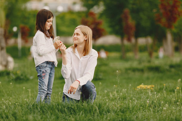 istock Elegant mother with daughter in a summer forest 1326194191