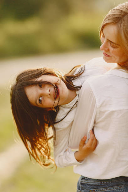 istock Elegant mother with daughter in a summer forest 1326194302