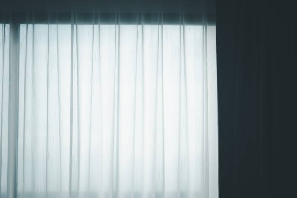 istock White see through window curtain in a home. Translucent white fabric curtains 1326196775