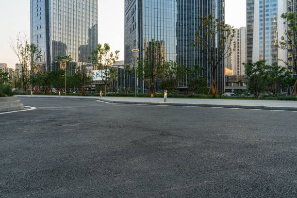istock empty asphalt road with modern office buildings in downtown. 1326198511