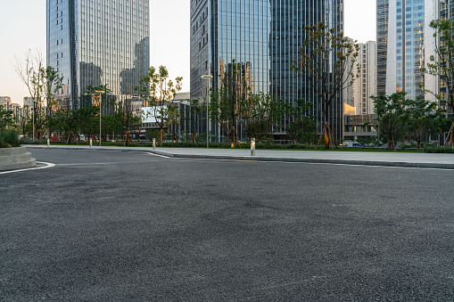 empty asphalt road with modern office buildings in downtown.