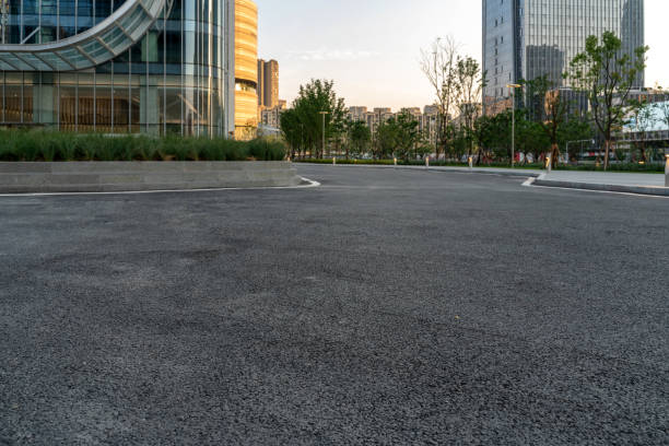 istock empty asphalt road with modern office buildings in downtown. 1326198594