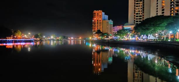 River life Night activity along the river in Kuching, Sarawak. kuching waterfront stock pictures, royalty-free photos & images