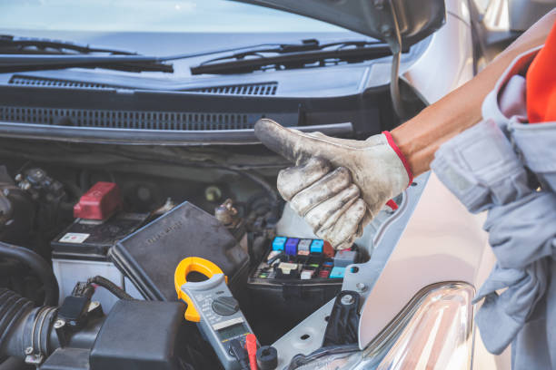 istock Technician man giving thumb up after checking engine, Car repair and maintenance concepts 1326203317