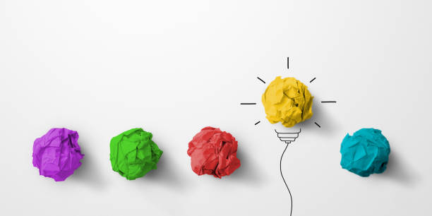 istock Concept creative idea and innovation. Paper scrap ball yellow colour outstanding different group with light bulb symbol 1326203341