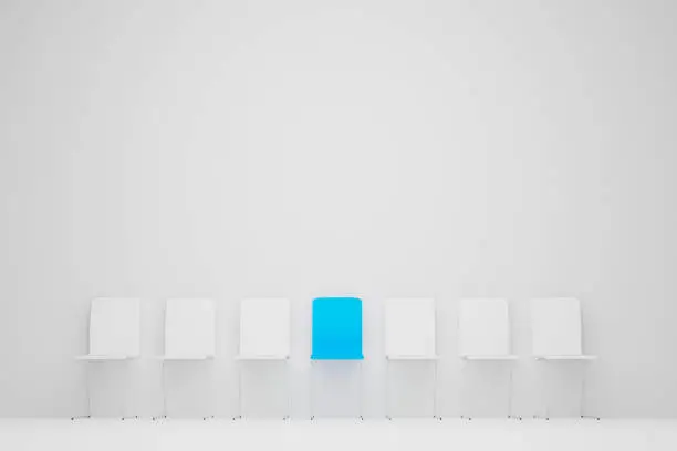 Photo of Outstanding chair in row. Blue chair standing out from the crowd. Human resource management and recruitment business concept. 3d illustration