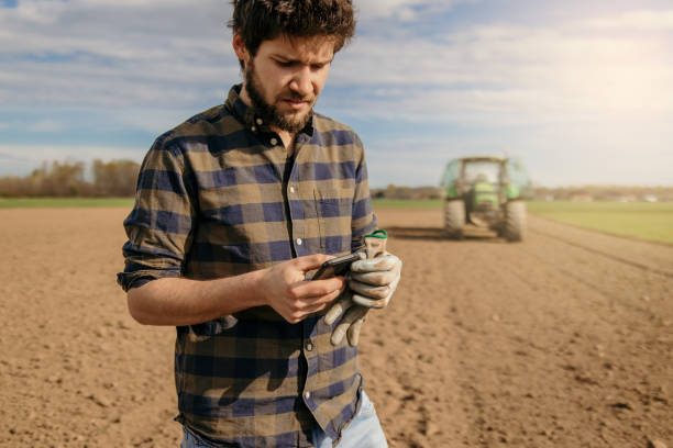 istock Portrait of a farmer using smartphone 1326203436