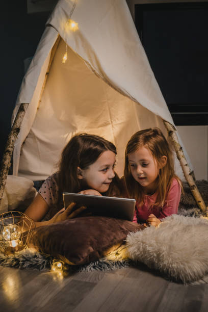 istock Young girls watching cartoon 1326205047