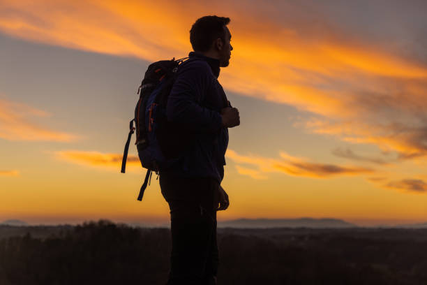 istock Silhouette of a man on the mountain 1326205511