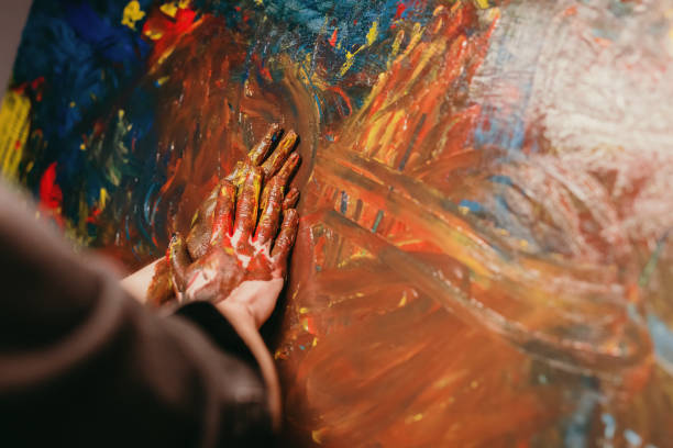 istock Close up of hands painting 1326206278
