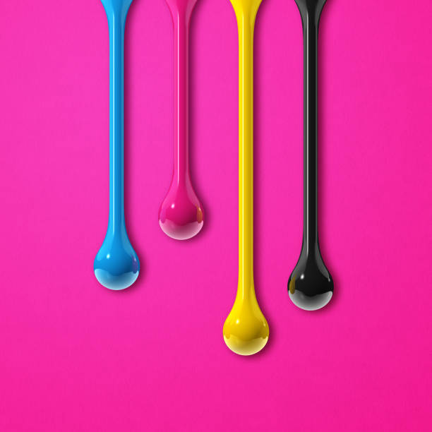 istock cmyk ink drops on pink paper square background 1326206498