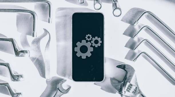 istock Phone service. Technician workplace with phone and special repairing tools. Cellphone technology device maintenance engineer. 1326207483