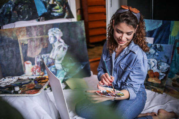 istock Creative young artist painting at home. 1326208600