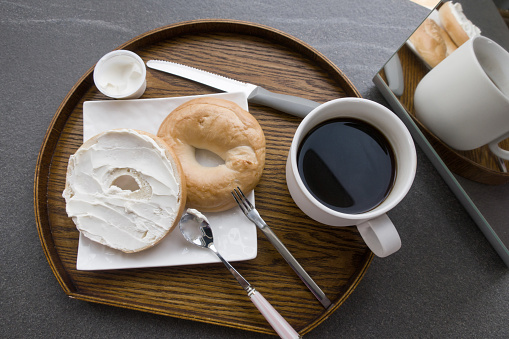 a plate of Bagel with Cream Cheese and Coffee