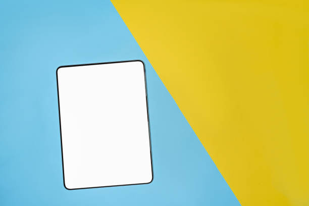istock Mock up digital tablet on two tone blue and yellow background. 1326209503