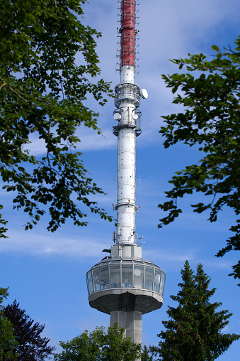 Radio tower at local mountain Uetliberg on a sunny summer day. Photo taken June 29th, 2021, Zurich, Switzerland.