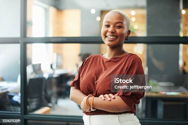 Portrait Of A Confident Young Businesswoman Working In A Modern Office Stock Photo - Download Image Now