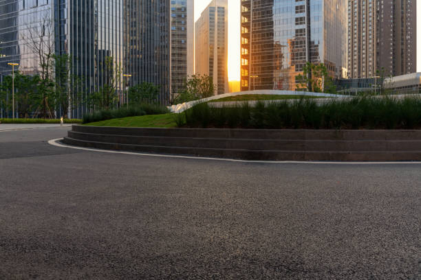 istock empty asphalt road with modern office buildings in downtown. 1326214605