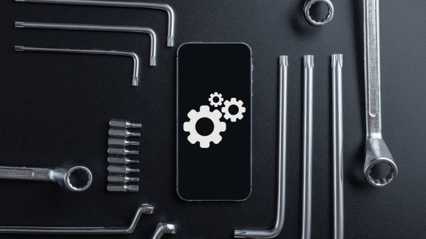 istock Mobile repair service. Technician workplace with phone and special repairing tools. Electronics repair service, device production concept. 1326214689