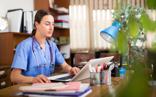 istock Doctor works in front of computers in private clinic 1326215776