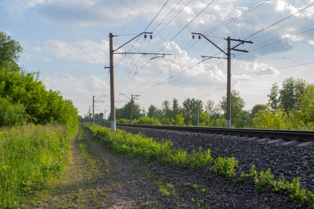 istock Russian railway. Green forest with blue sky and clouds. 1326216629