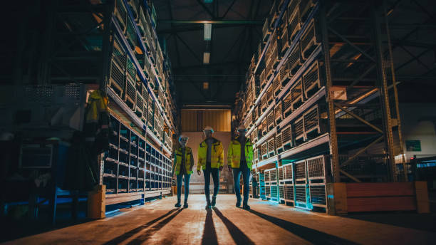 istock Co-workers walking together in a factory 1326217474