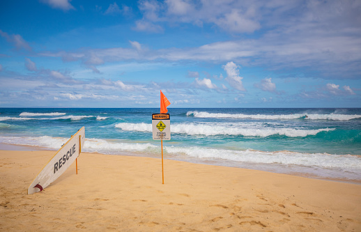Danger sign and surfboard for rescue Sandy Beach in Oahu, Hawaii