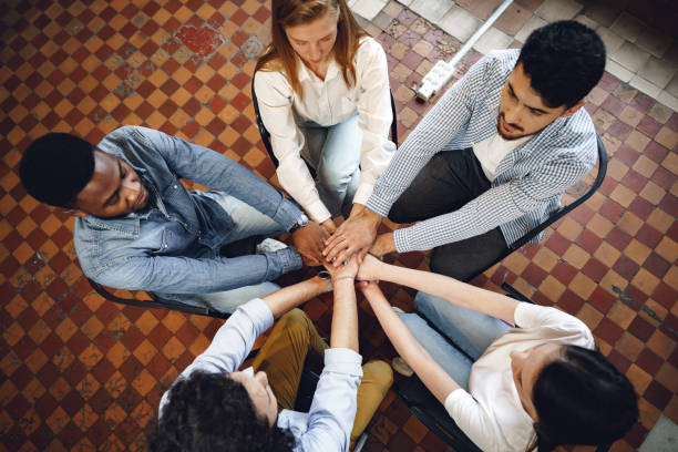 istock Top view of diverse people hands holding together in circle, hands stack 1326219837