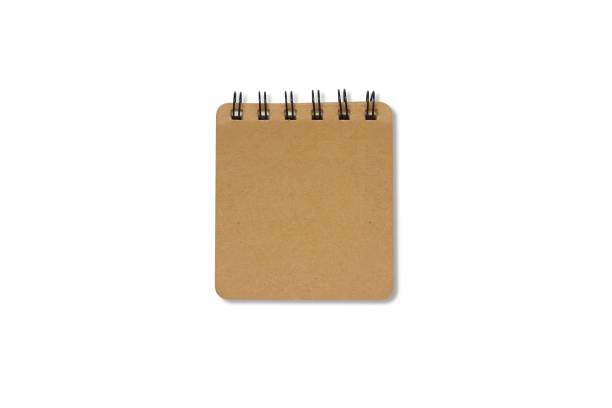 Brown hardcover notebook with a black loop. Blank book isolated on white background with clipping path. Top view. stock photo
