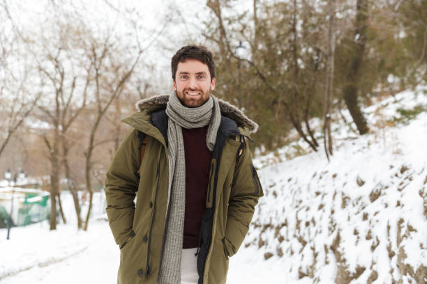 istock Handsome smiling young man wearing winter jacket 1326221203