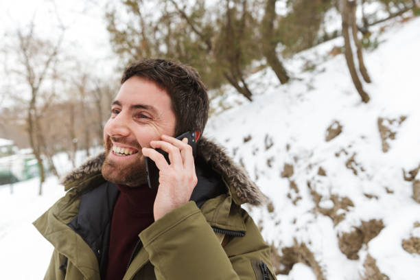 istock Handsome young man wearing winter jacket 1326221222