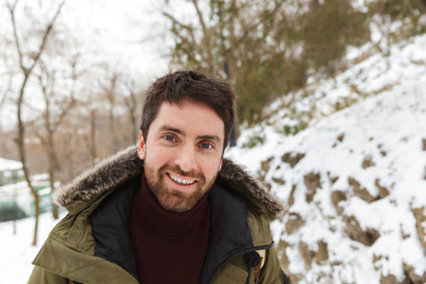 istock Handsome young man wearing winter jacket 1326221816