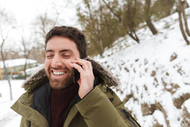 istock Handsome young man wearing winter jacket standing 1326221876