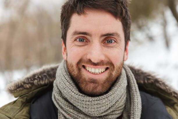 istock Handsome smiling young man wearing winter jacket 1326221885