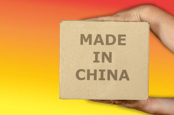 istock Hands holding a cardboard box on a colored background. 1326221889
