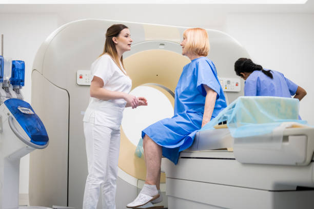 istock Senior woman talking with a doctor before CAT scan 1326225670