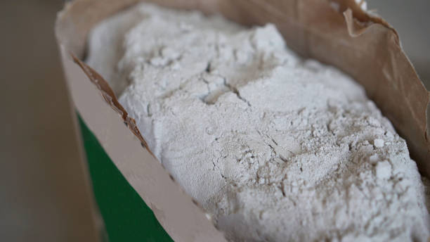 istock Opened paper bag with dry mortar for construction work. Construction putty in a bag 1326226184