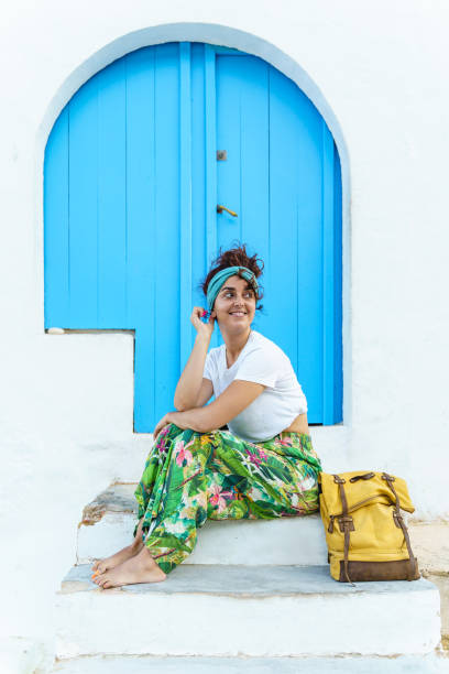 istock Vertical view of woman with backpack on holidays. 1326226542