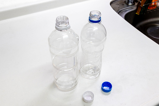Empty plastic bottles with caps removed