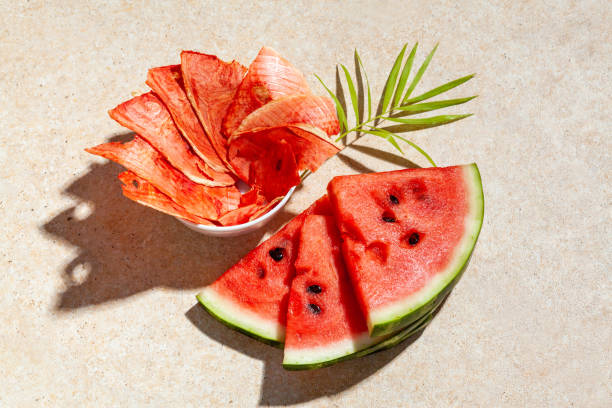 https://media.istockphoto.com/id/1326230822/photo/slices-of-dried-watermelon-with-fresh-pieces-on-light-background-with-deep-shadow.jpg?s=612x612&w=0&k=20&c=E9H6wMJMDa0sGLZcSnX1812eU6r139Li-VjyjY_V-54=