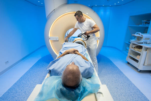 istock Male radiologist preparing his patient before MRI scan 1326232430
