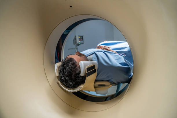 istock Mature man being slid into the CAT scanner 1326232985