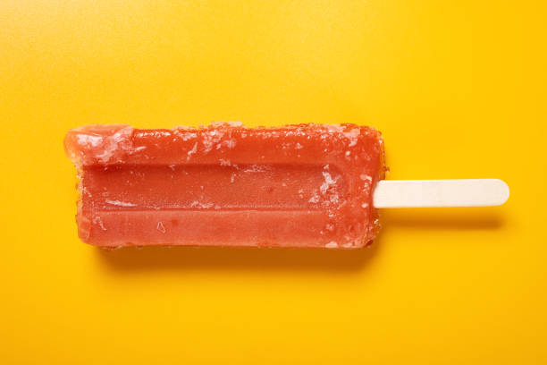 istock top view fresh red popsicle on a yellow background 1326234217
