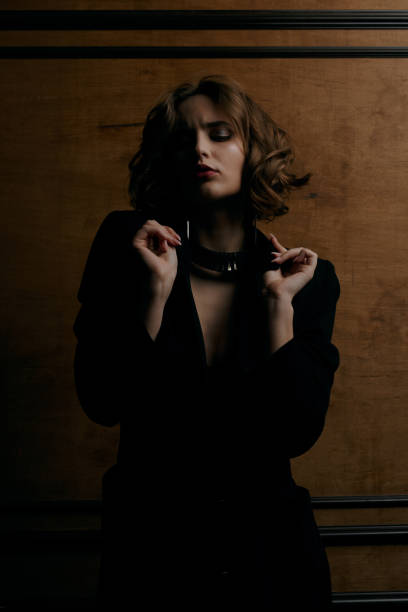 istock Portrait of luxurious lady at studio with shadows 1326239128