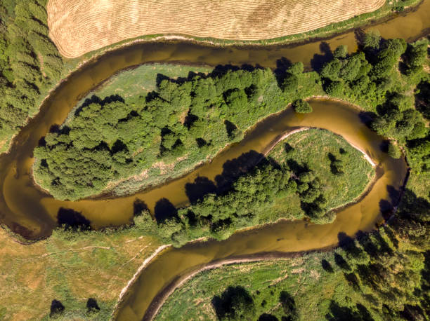 istock beautiful landscape with a small meandering river (aerial view) 1326240096