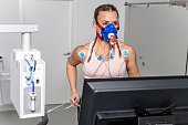 Woman running on the treadmill ergometer during a cardiopulmonary stress test