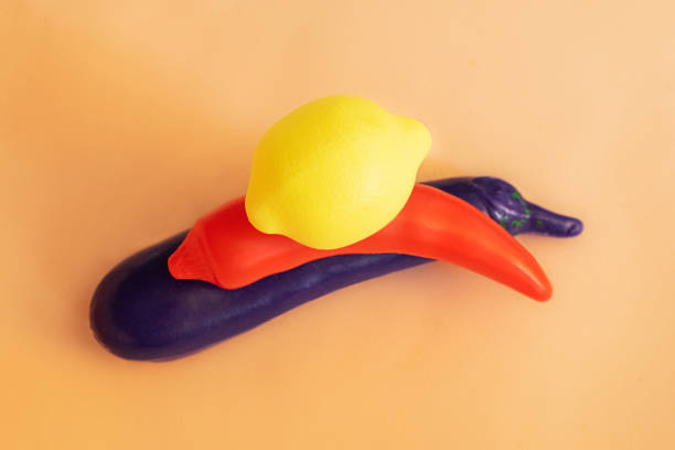 istock Yellow plastic lemon on top on toy vegetables. 1326241550