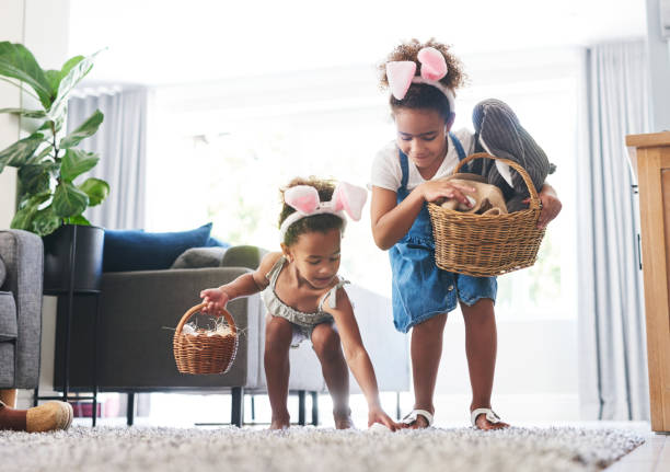 istock Shot of two sisters during a easter hunt at home 1326243144