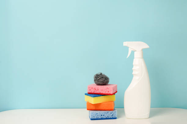 istock white bottle with cleaning procuct and sponges on blue background with empty space for text 1326246528